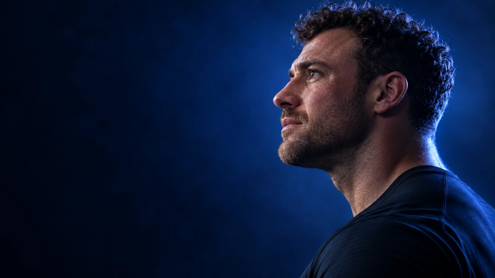 Blue-lit athletic portrait, illustrative fitness imagery